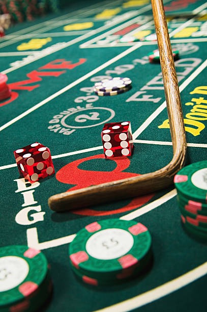 Live croupier at roulette table with multi-camera feed